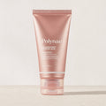 Polynae Collagen Night Wrapping Mask tube standing upright on a light stone surface against a neutral background