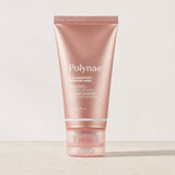 Polynae Collagen Night Wrapping Mask tube standing upright on a light stone surface against a neutral background