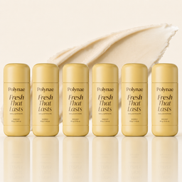 Six Polynae “Fresh That Lasts” Vanilla & Pistachio deodorant sticks lined up evenly on a glossy surface, set against a warm cream background with a large textured product smear behind them.