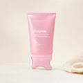 Polynae PDRN Collagen Gua Sha Neck Wrinkle Cream pink tube standing upright on a gua sha applicator base against a neutral beige background