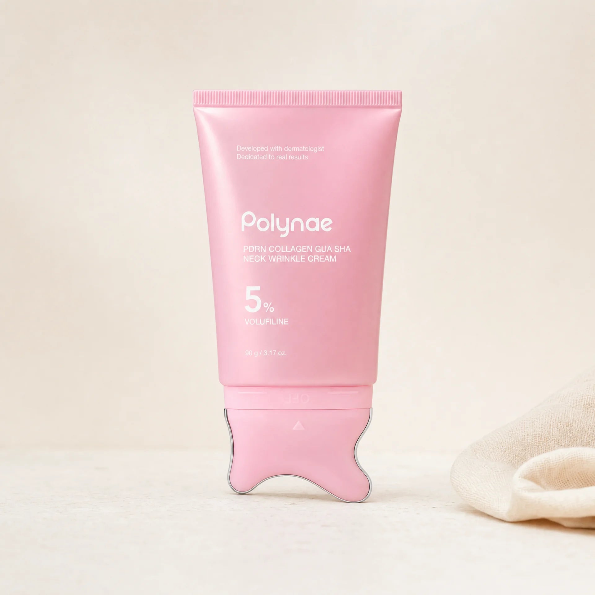 Polynae PDRN Collagen Gua Sha Neck Wrinkle Cream pink tube standing upright on a gua sha applicator base against a neutral beige background