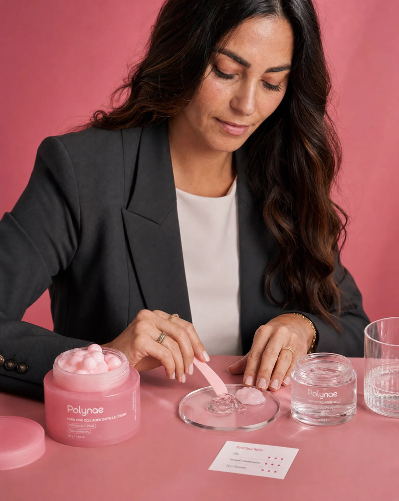 Woman in a blazer pressing a spatula into Polynae cream on a petri dish beside the open pink jar
